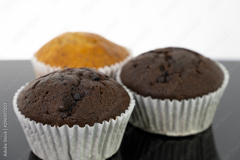 Delicious of banana and chocolate chip cupcake isolated on black background Delicious of banana and chocolate chip cupcake isolated on black background