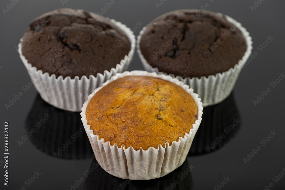 Delicious of banana and chocolate chip cupcake isolated on black background Delicious of banana and chocolate chip cupcake isolated on black background