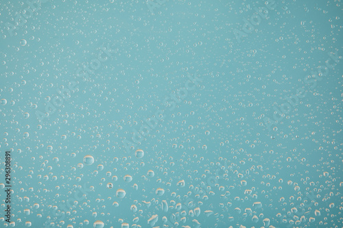clear transparent water drops on light blue background © LIGHTFIELD STUDIOS