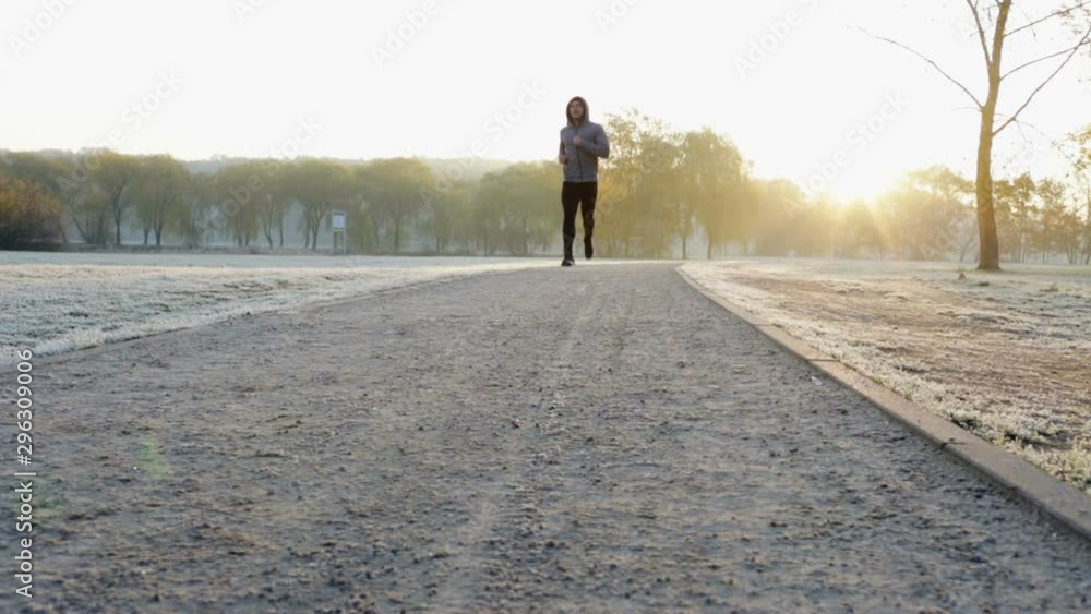 young athlete running at cold winter morning - slider. young athlete running at cold winter morning - slider.