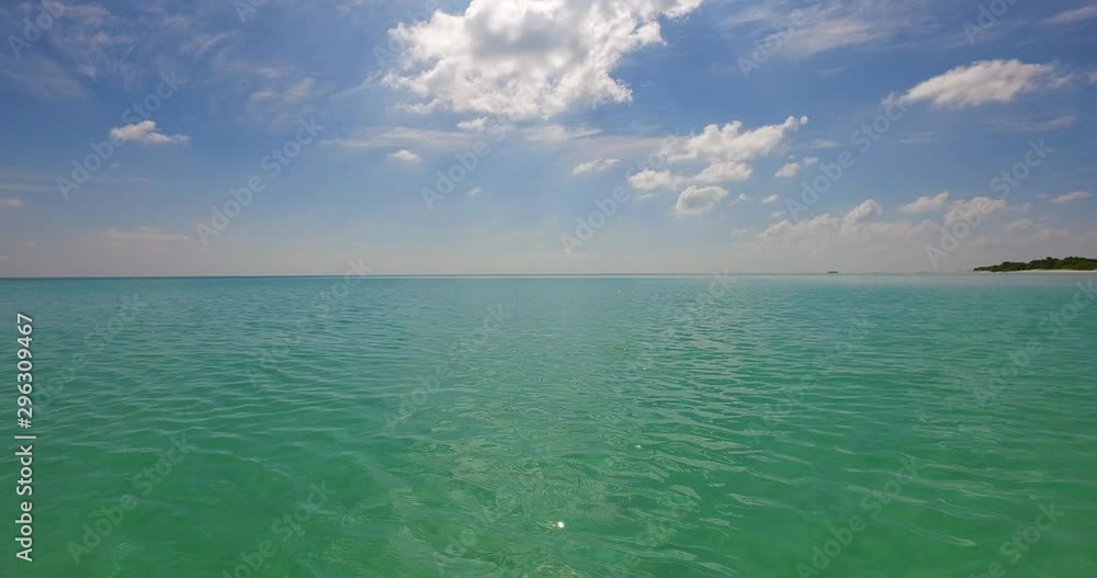 Sunlight reflecting off of calm ripples formed on blue green tropical water in the Philippines Sunlight reflecting off of calm ripples formed on blue green tropical water in the Philippines