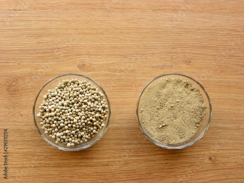 peppercorns and ground pepper in a glass bowl