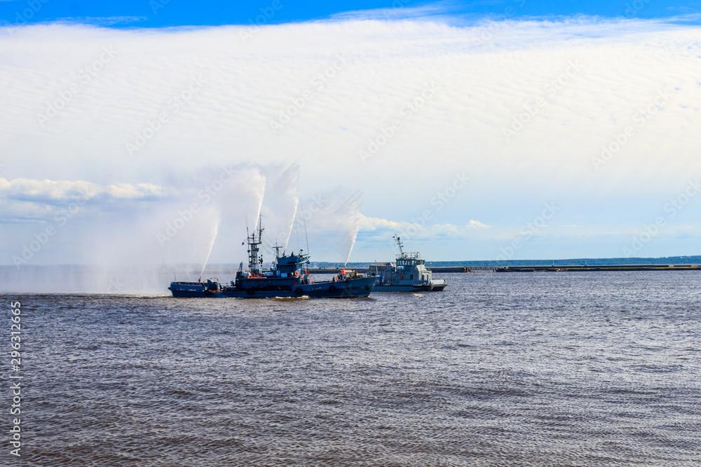 Extinguishing a burning ship during naval exercises