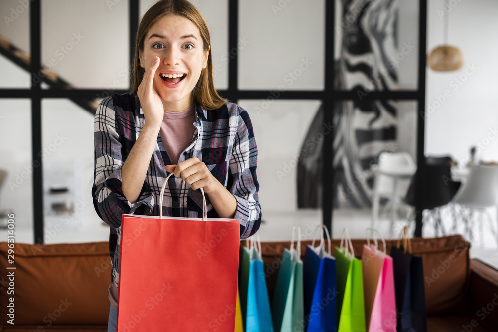 Woman telling a secret and holding a paper bag Woman telling a secret and holding a paper bag