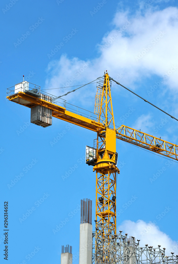 Crane and highrise construction site Crane and highrise construction site