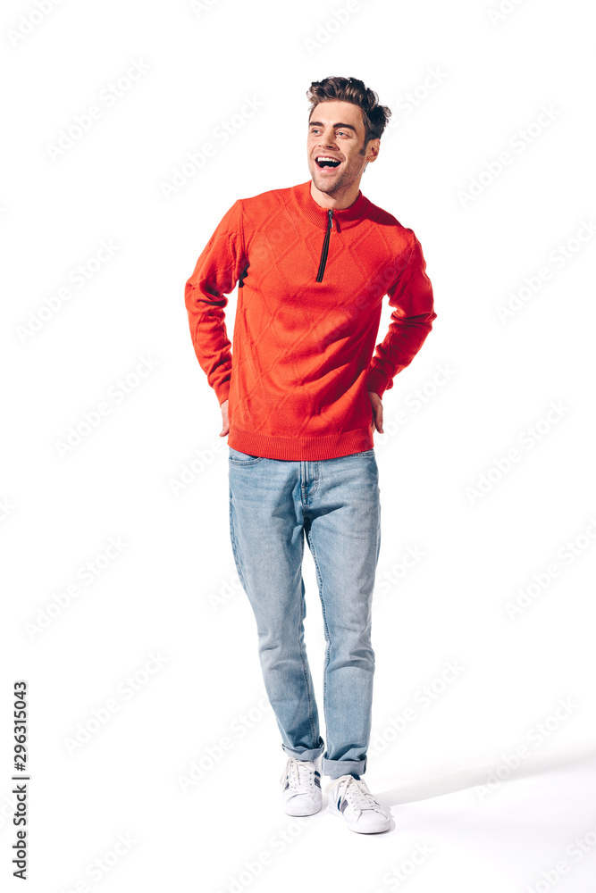 Naklejka premium handsome cheerful man in red sweater, isolated on white