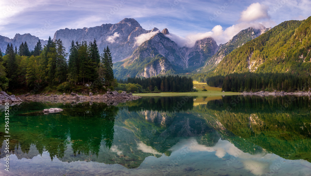 magnificent landscape which consists of a panorama of mountain lake and mountains reflecting in a mirror of water of the lake