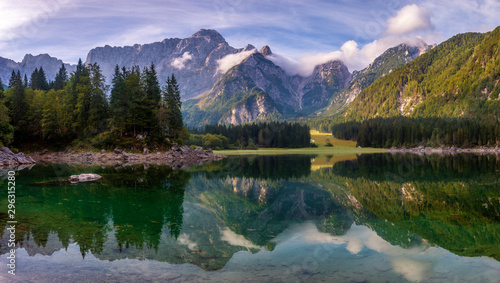 magnificent landscape which consists of a panorama of mountain lake and mountains reflecting in a mirror of water of the lake © Mike Mareen