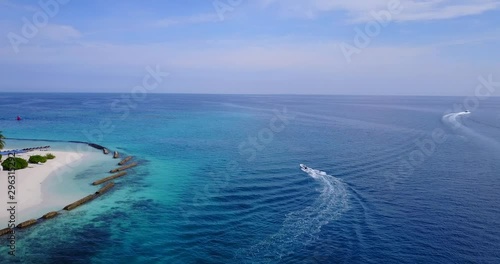 Boat in the ocean, close to the beach photo