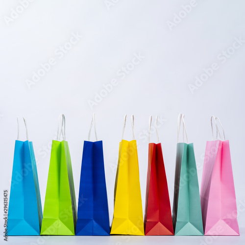 Group of colourful bags displayed in a row © Freepik