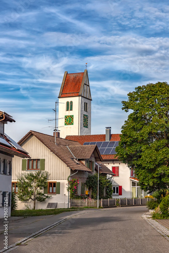 Fototapeta Naklejka Na Ścianę i Meble -  a small quiet street with houses and a clock tower in Leutkirch, Germany