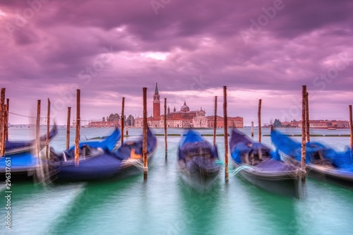 Gondolas moored by Saint Mark square, Venice, Italy, Europe. © StockPhotoAstur