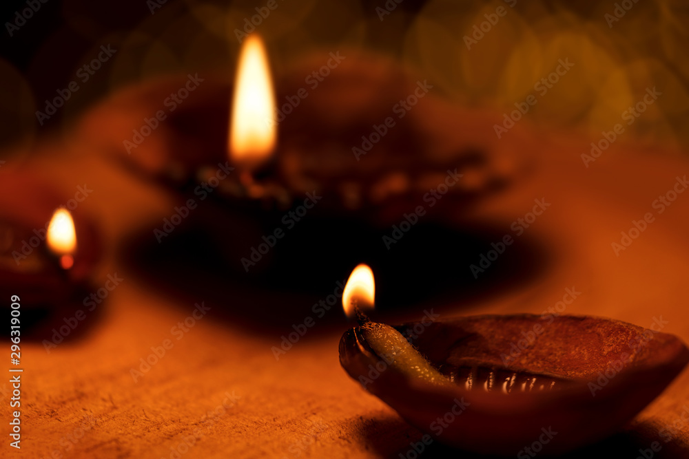 Diwali Diya Background. Traditional Diwali Oil lamps or diya lit on the  occasion of diwali festival in India with copy space. Background image with  bokeh for hindu culture, tradition, temple, village. Stock