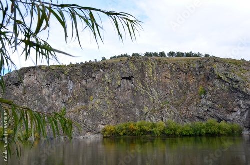 Beautiful landscape of the beginning of autumn on the river bank.
