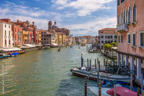 View of Grand Canal with gondolas and boats riding, Venice, Italy