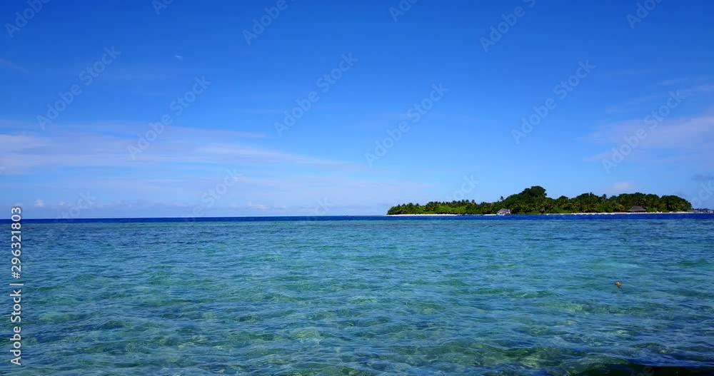 Beautiful tropical island with tall palm trees on white sandy exotic beach and amazing crystal clear blue ocean lagoon Beautiful tropical island with tall palm trees on white sandy exotic beach and amazing crystal clear blue ocean lagoon