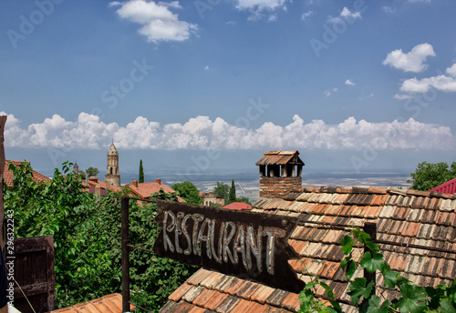 Beautiful landscape with blue sky and greenery. Sign with the inscription - Restaurant. Georgia, Alazani Valley, Kakheti, Sighnaghi - a city of love. photo