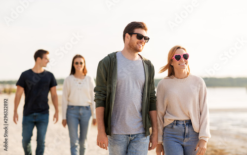 Принти на полотні friendship, leisure and people concept - group of happy friends walking along be