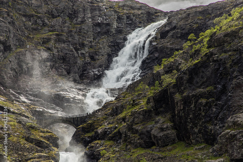 Norwegian mountain road. Trollstigen. Stigfossen waterfall over the Norway tourist landscape valley.