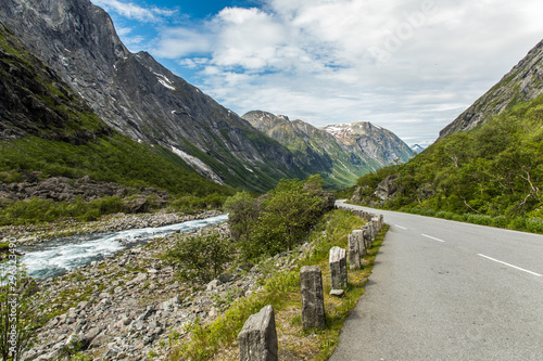 Norwegian mountain road. Trollstigen. Stigfossen waterfall over the Norway tourist landscape valley.