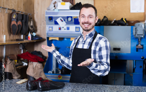 Ordinary man worker displaying his workplace