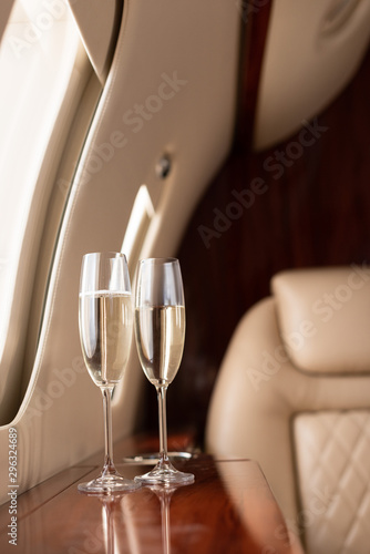 Принти на полотні interior of plane with champagne glasses for trip
