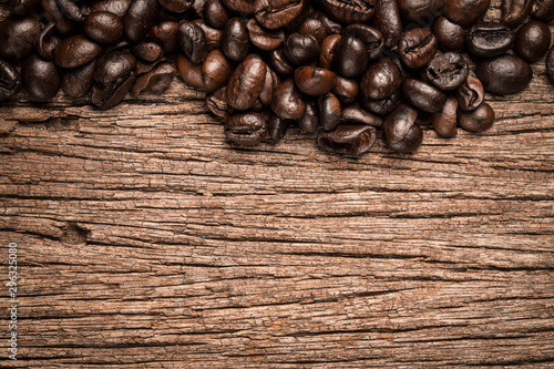 Coffee beans on wood background