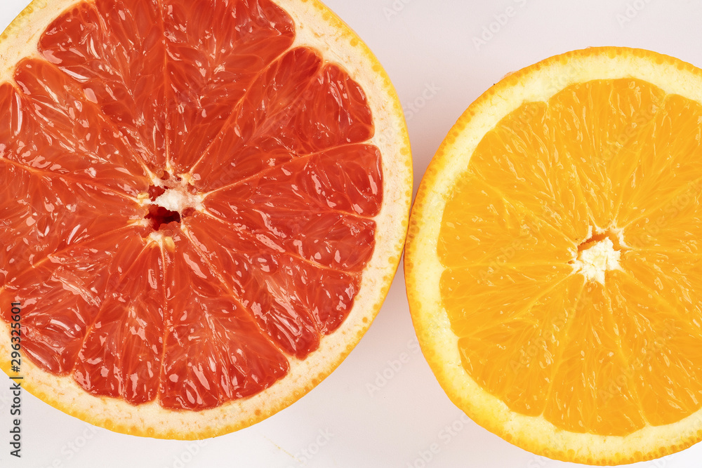 Orange grapefruit slice closeup on white background Orange grapefruit slice closeup on white background
