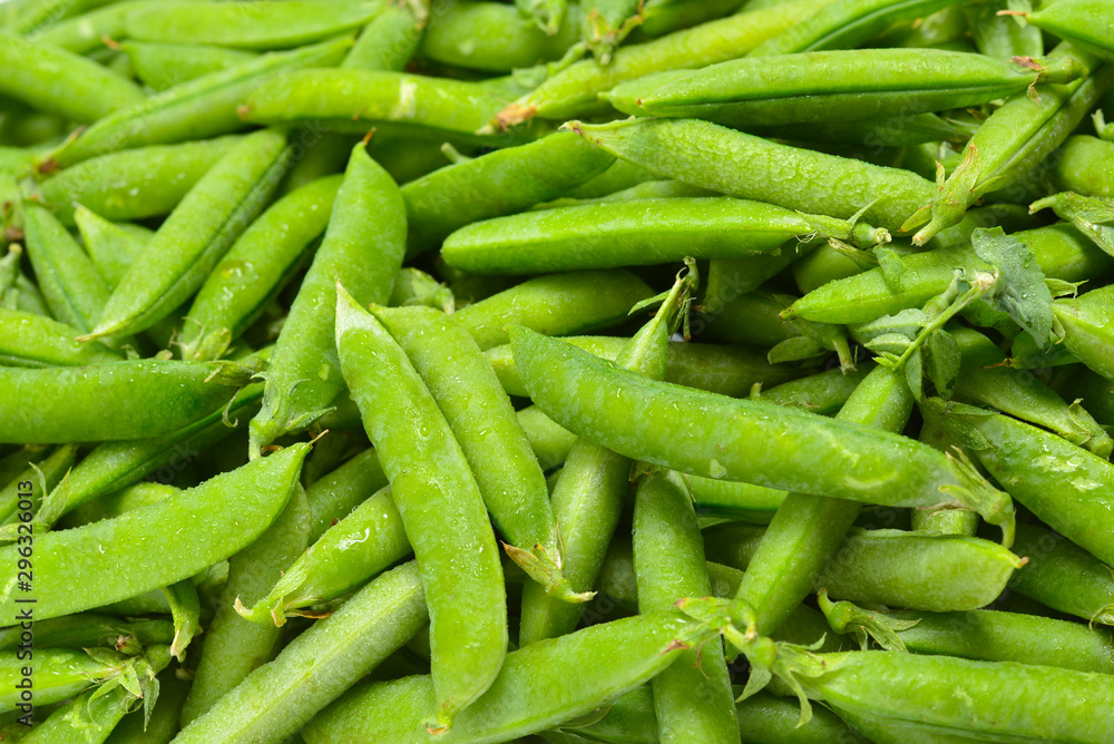 Fresh pea pods as background. Top view. Fresh pea pods as background. Top view.