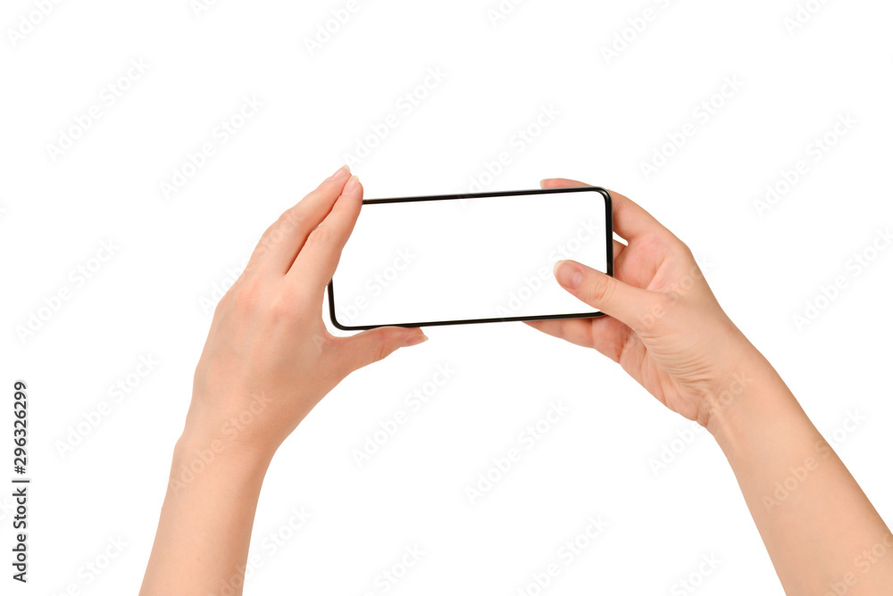 Smart phone in woman hands isolated on white background. White screen. Copy space. Smart phone in woman hands isolated on white background. White screen. Copy space.
