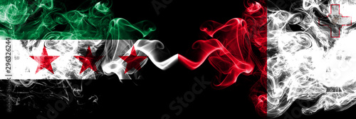 Syrian Arab Republic vs Malta, Maltese smoke flags placed side by side. Thick colored silky smoke flags of Syria opposition and Malta, Maltese photo