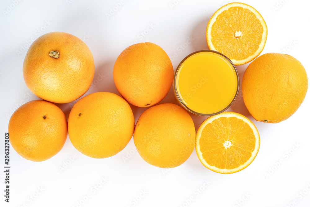 Fresh orange juice in glass on white yellow background Fresh orange juice in glass on white yellow background