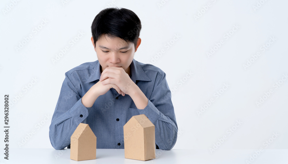 business smart asian man with house model on table house business dicision white background business smart asian man with house model on table house business dicision white background