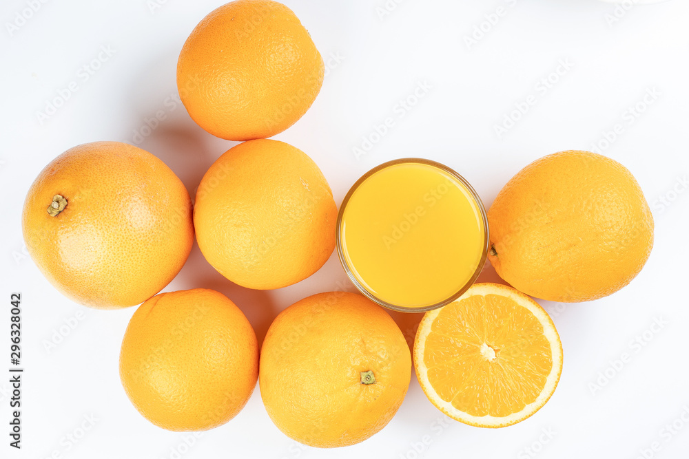 Fresh orange juice in glass on white yellow background Fresh orange juice in glass on white yellow background