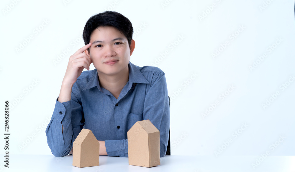 business smart asian man with house model on table house business dicision white background business smart asian man with house model on table house business dicision white background