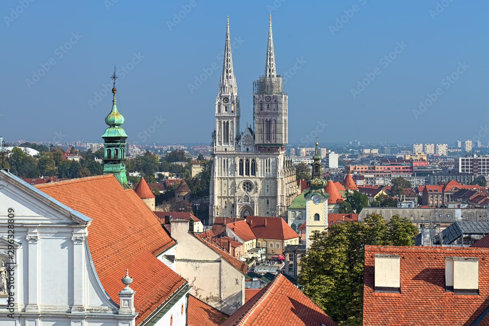 Zagreb, Croatia. Zagreb Cathedral, tower of St. Mary Church at Dolac and fragment of St. Catherine Church in foreground. View from observation deck at Lotrscak tower.