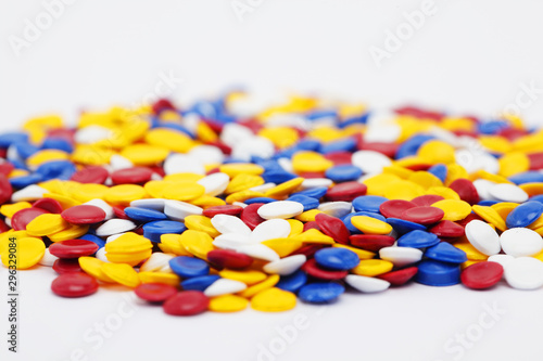 close up of colorful industrial plastic pellets background