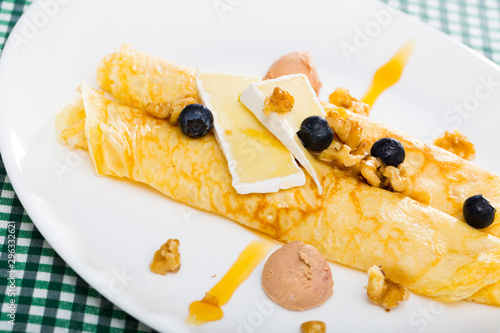 Pancakes with cheese Brie, blueberry and fuagra photo