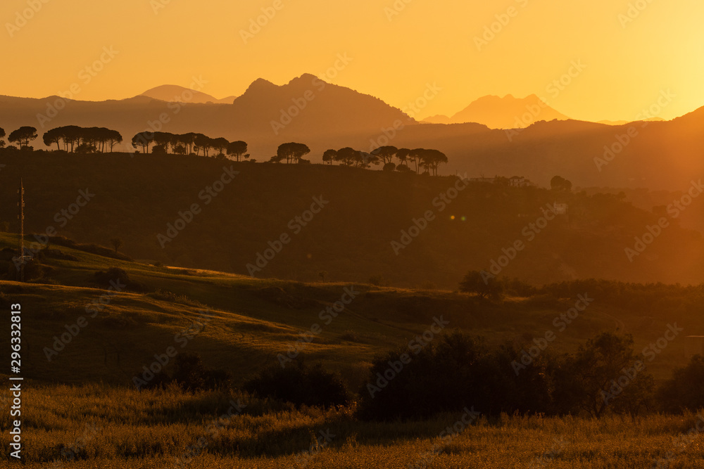Obraz premium Sunset with mountains around AMAZING Ronda village, SPAIN