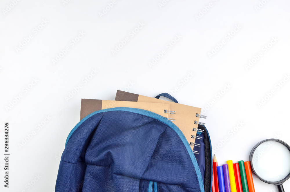 View of flat lay with school backpack and stationery with space for text on white background. Selective focus. View of flat lay with school backpack and stationery with space for text on white background. Selective focus.