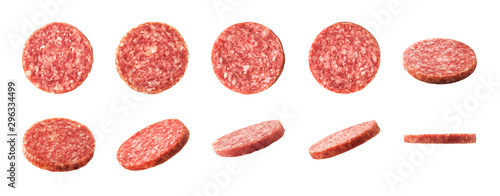 Fotografie, Obraz Top and side views of smoked salami sausage slices isolated on white background
