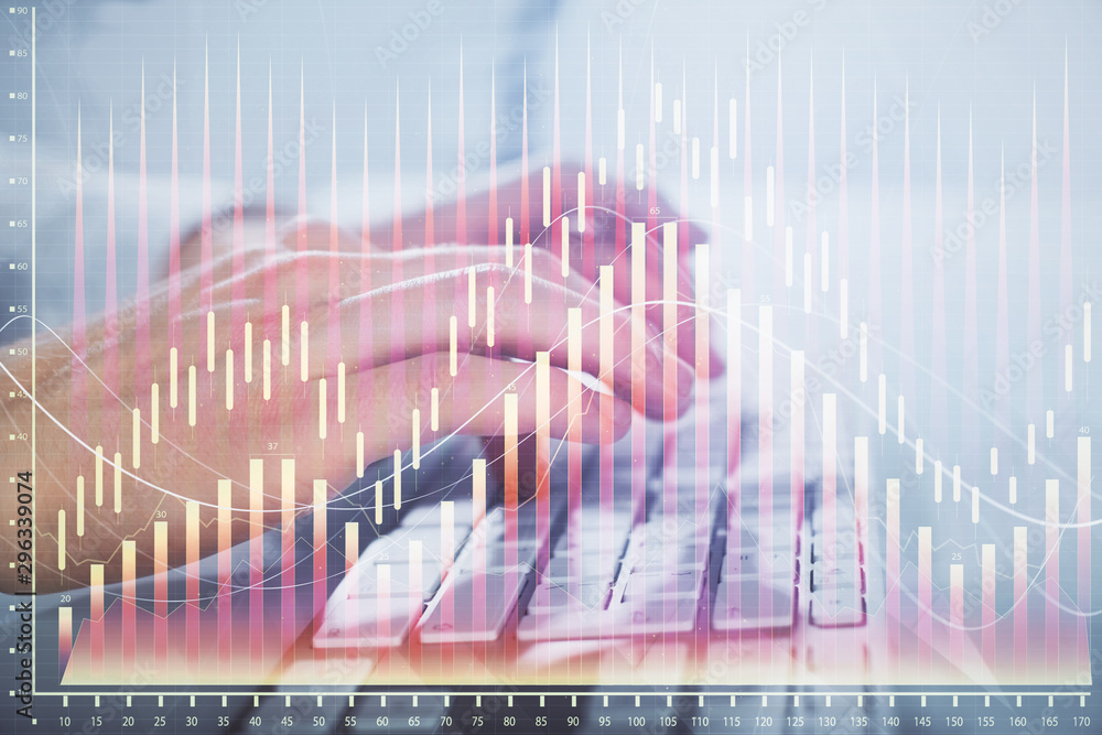 Multi exposure of graph with man typing on computer in office on background. Concept of hard work. Closeup. Multi exposure of graph with man typing on computer in office on background. Concept of hard work. Closeup.