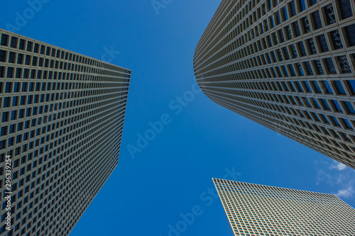 modern city skyscraper high building perspective urban photography from below on blue sky background 