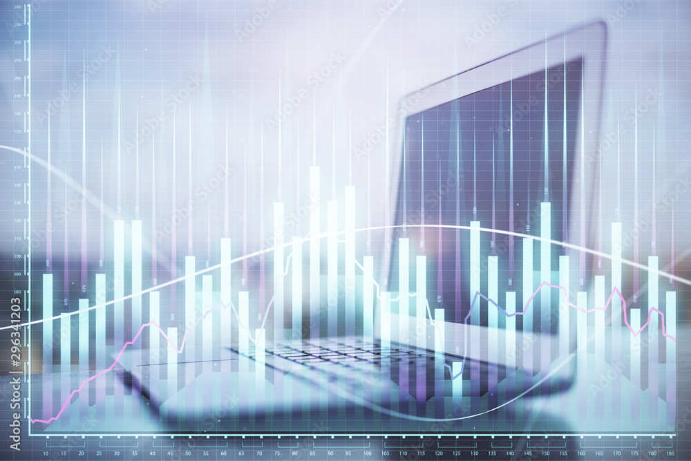 Stock market graph on background with desk and personal computer. Double exposure. Concept of financial analysis.