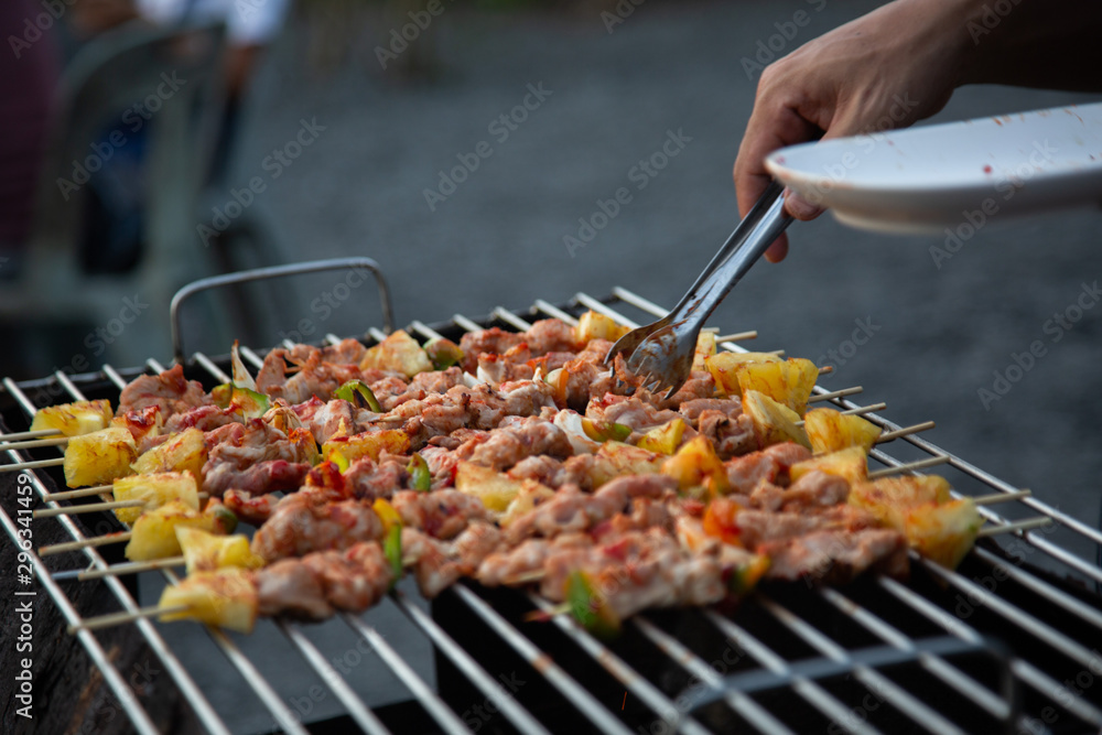 Barbeque Grill Street Food in thailand,Eat outdoors in a happy family. holiday celebration concept