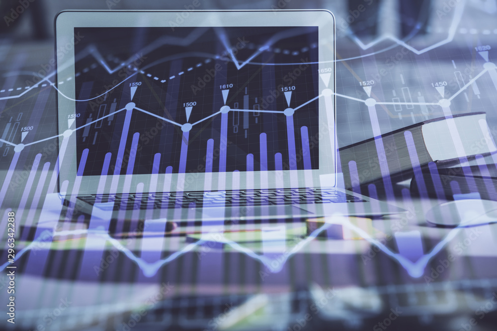 Forex market chart hologram and personal computer background. Multi exposure. Concept of investment.