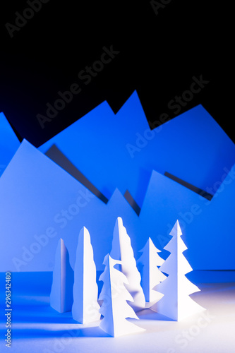 Snowy landscape of high mountain with white pines  and house in the middle of the landscape.