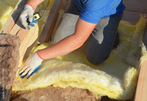 Принти на полотні Contractor Insulating with Mineral Wool Attic Roof