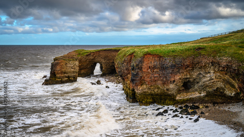 Magnesian Limestone Cliffs below Souter Lighthouse, located on the South Tyneside coastline at Lizard Point  photo