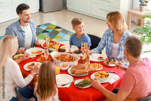 Big family having dinner at...